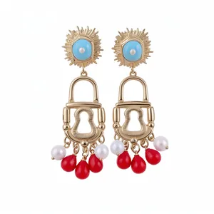 Vintage Bohemian sun lock earrings with enamel details and red teardrop bead dangles