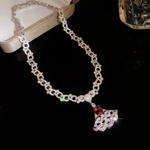 Exquisite sparkling silver-tone necklace featuring a red gem and fan-shaped zircon pendant