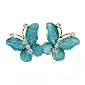 Elegant teal enamel butterfly stud earrings with sparkling zircon accents in gold finish