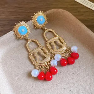 Vintage enamel sun padlock earrings with bohemian teardrop beads and pearl charms
