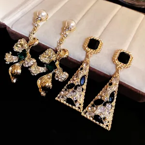 Elegant vintage crystal studded earrings with triangle pendant and floral pearl designs
