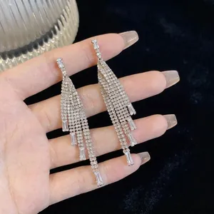 Elegant long silver tassel earrings with sparkling rhinestones and zircon accents