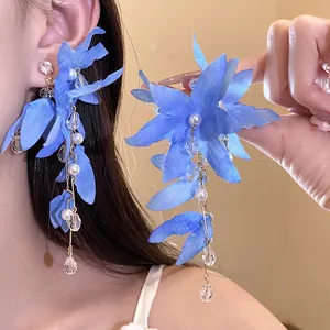 Elegant blue fabric flower tassel earrings with pearls and crystals for a vacation look