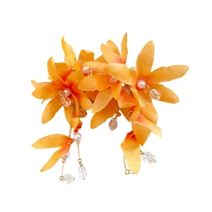 Handmade orange fabric flower dangle earrings featuring elegant pearl and crystal tassels