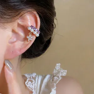 Elegant French style star and pearl ear cuff for non-pierced ears shown on female model