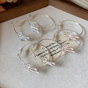 Elegant silver bow-knot hoop earrings with colorful enamel and sparkling zircons