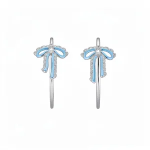 Exquisite silver bow hoop earrings with light blue enamel and sparkling zircon stones