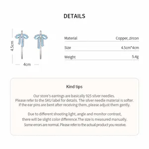 Detailed view of blue ribbon bow earrings featuring zircon inlay and size specifications