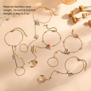 Detail view of gold butterfly and flower stainless steel finger bracelets with dimensions