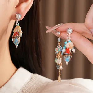 Close-up detail of handmade vintage ethnic earrings with colorful glass beads for women