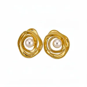 Elegant vintage gold-toned circular winding earrings featuring central lustrous pearls