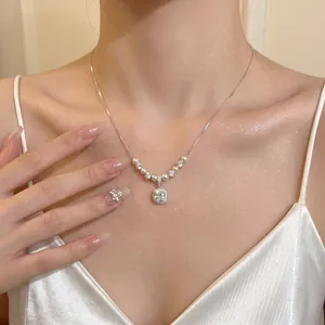 Elegant silver-tone necklace featuring a square zircon pendant and delicate pearls