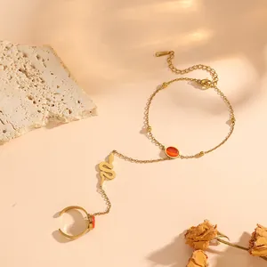 Gold-plated titanium steel finger bracelet featuring a snake charm and orange stones