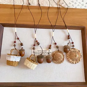 Handmade acorn and straw hat pendant necklace with rustic forest aesthetic