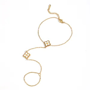 Gold-plated stainless steel flower hand chain bracelet shown in an elegant S-curve
