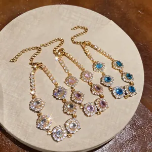 Eleganti bracciali placcati oro 18 carati con zirconi tondi e catenella di estensione