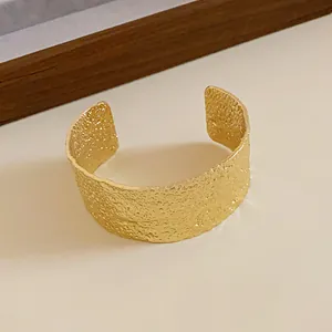 Vintage gold wide hammered texture open cuff bracelet with an elegant matte metal finish