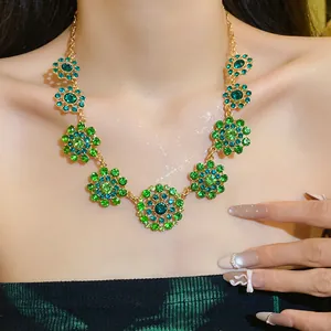 Luxury vintage gold-tone necklace with green rhinestone floral pendants for women