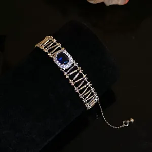 Detailed view of a vintage silver-tone bracelet featuring an oval blue zircon centerpiece