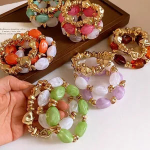 Pulsera elástica retro de acrílico con cuentas geométricas doradas