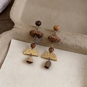 Vintage handmade forest style earrings with wooden beads and maple leaf charms