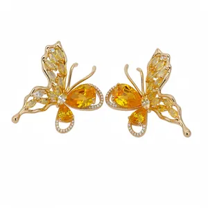 Elegant gold-plated butterfly stud earrings adorned with vibrant yellow cubic zirconia stones