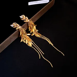 Detailed view of elegant gold wheat ear tassel clip-on earrings with zircon crystal accents