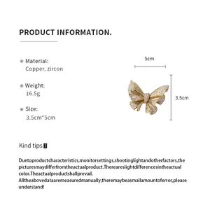 Detailed size and material specs for the gold butterfly brooch with zircon inlays.