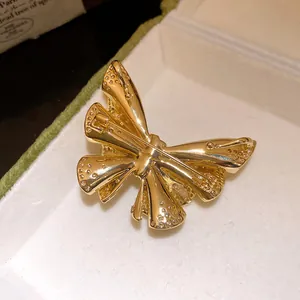 Close-up detail showing the back and pin of this 18k gold plated butterfly brooch