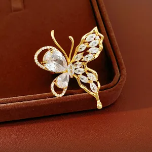 Detail shot of a gold-plated butterfly earring with sparkling cubic zirconia stones.