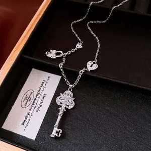 Vintage silver key necklace with heart charms and zircon stones, adjustable chain necklace.