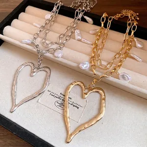 Elegant retro chunky chain necklaces featuring baroque pearls and a hammered heart pendant