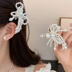 Elegant white pearl flower bow hair clips shown with model wearing as side pin.