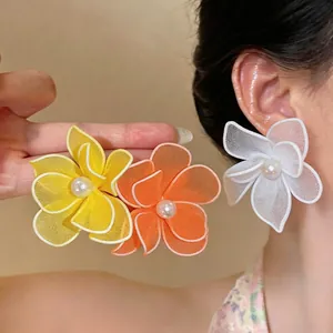 Elegant mesh flower earrings with pearl center in white yellow and orange colors