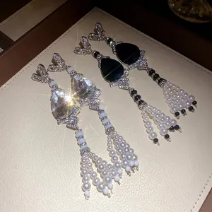 Elegant teardrop crystal and pearl tassel dangling earrings with silver needles