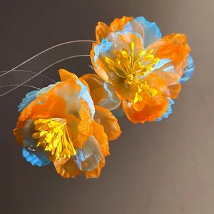 Elegant bohemian chiffon flower stud earrings in vibrant orange and blue sunset hues