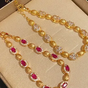 Elegant gold-plated bracelet featuring oval zircon stones and frosted gold beads.