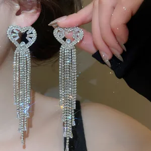 Sparkling heart-shaped tassel earrings with silver rhinestones for a premium look.