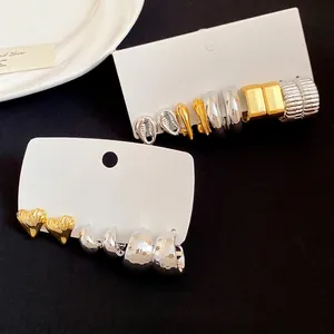 Vintage heart and geometric stud earring set with gold and silver finishes on cards