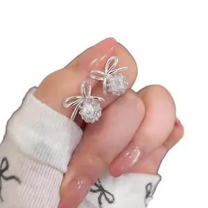 Elegant French style silver bow stud earrings featuring a sparkling clear zircon pendant