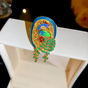 Close-up detail showing the colorful enamel peacock pattern on this 18K gold plated ring