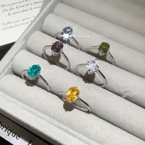 Vintage square open rings with colorful gemstones in luxury velvet jewelry box