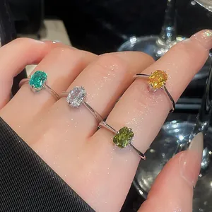 Close-up detail of luxury vintage silver open rings with colorful square gemstones