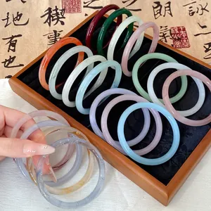 Collection of colorful faux jade glass bangles in traditional Chinese style for women