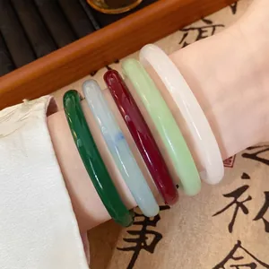 Set of five colorful faux jade glass bangles in traditional Chinese round style
