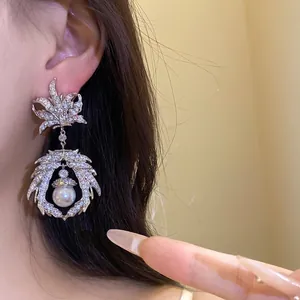 Vintage silver maple leaf dangle earrings with sparkling zircon and central pearl drop