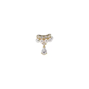 Elegant gold ear cuff with sparkling zircons, white pearls, and a teardrop pendant.