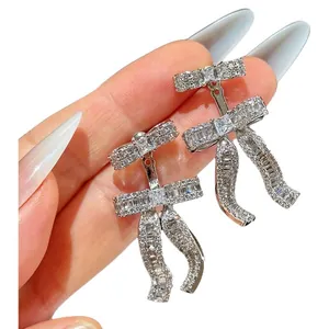 Elegant 18k gold plated bow-knot dangle earrings with sparkling zircon stones inlay