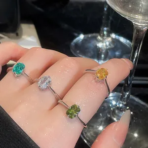 Close-up of vintage square open rings with vibrant multi-color gemstones
