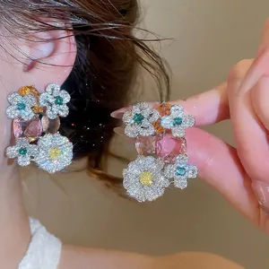 Elegant zircon flower earrings with pink and green crystals in sweet luxury style.